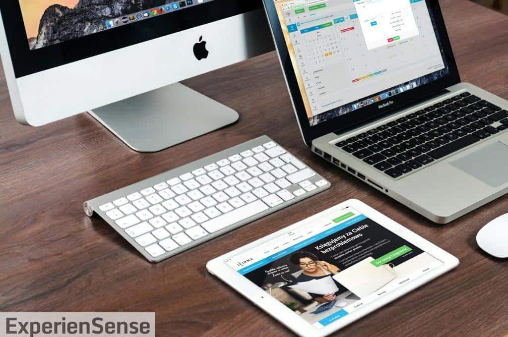 Turned on Imac Beside Macbook on Table