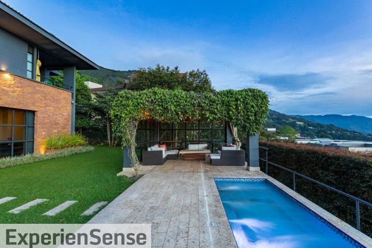 a house with a swimming pool in front of it