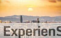 A stunning sunset view of the Barcelona skyline showcasing iconic landmarks and a warm, golden hour glow.